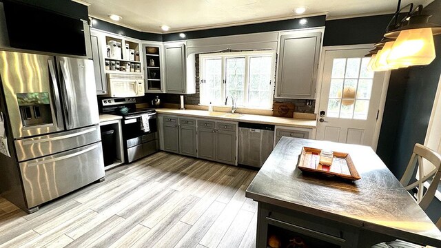 644 Genesee Ave, Morrison, IL 61270 - kitchen featuring stainless steel appliances, gray cabinets, open shelves, light wood-type flooring, and ornamental molding