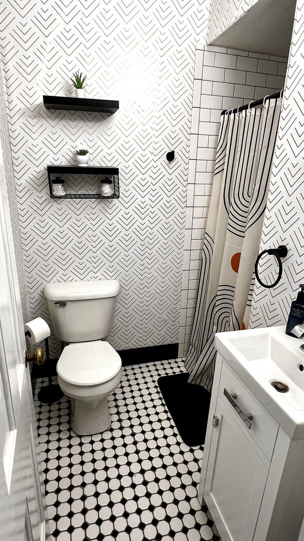 644 Genesee Ave, Morrison, IL 61270 - bathroom with vanity, a shower with curtain, and tile patterned floors