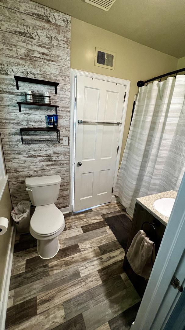 644 Genesee Ave, Morrison, IL 61270 - bathroom featuring vanity and wood finished floors