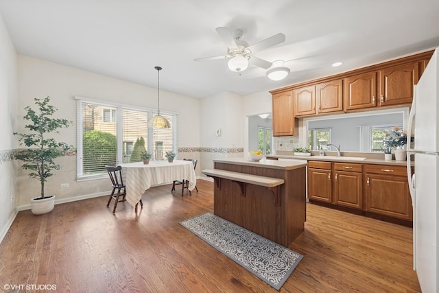 122 Santa Fe Ln, Willow Springs, IL 60480 - kitchen with light countertops, a center island, wood finished floors, and recessed lighting