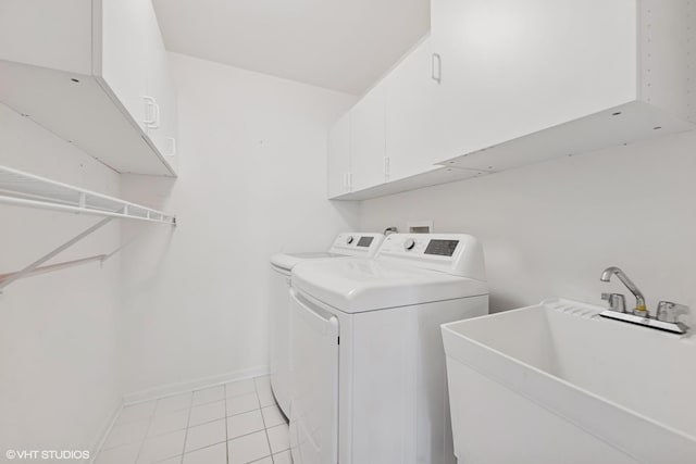122 Santa Fe Ln, Willow Springs, IL 60480 - laundry area featuring cabinet space, washer and dryer, and light tile patterned floors