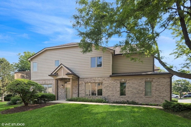 122 Santa Fe Ln, Willow Springs, IL 60480 - traditional home featuring brick siding, a front lawn, and a shingled roof