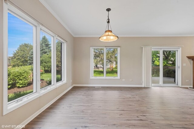 122 Santa Fe Ln, Willow Springs, IL 60480 - unfurnished room with plenty of natural light, wood finished floors, and crown molding