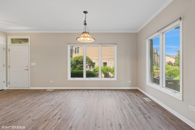 122 Santa Fe Ln, Willow Springs, IL 60480 - unfurnished room with healthy amount of natural light, wood finished floors, and ornamental molding