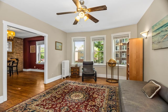 132 Clyde Ave Unit 1, Evanston, IL 60202 - office space with radiator, plenty of natural light, wood finished floors, and a chandelier