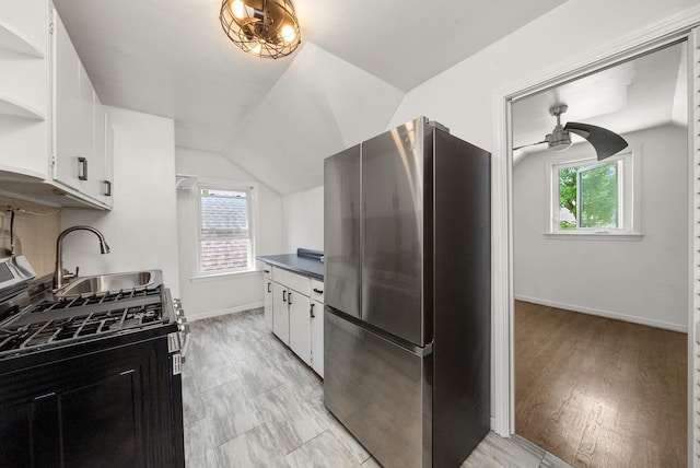 3647 N Nordica Ave, Chicago, IL 60634 - kitchen featuring stainless steel appliances, lofted ceiling, open shelves, a sink, and white cabinets