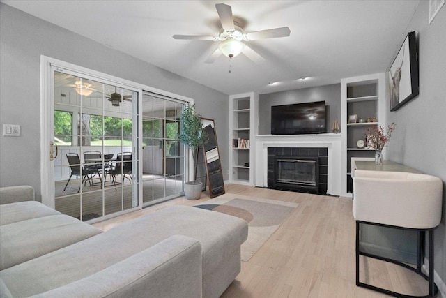 232 Lexington Ct, Grayslake, IL 60030 - living room with a ceiling fan, a fireplace, built in features, and wood finished floors