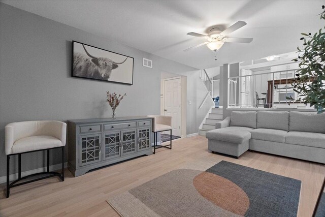 232 Lexington Ct, Grayslake, IL 60030 - living area featuring stairs, ceiling fan, and wood finished floors