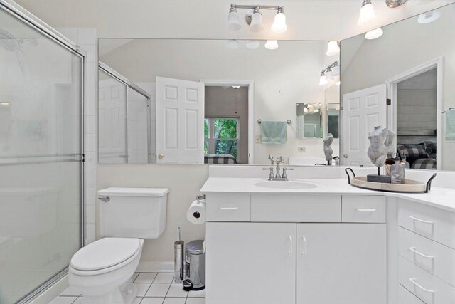 232 Lexington Ct, Grayslake, IL 60030 - ensuite bathroom featuring tile patterned floors, vanity, and a stall shower
