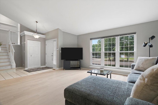 232 Lexington Ct, Grayslake, IL 60030 - living area featuring lofted ceiling, stairway, and wood finished floors