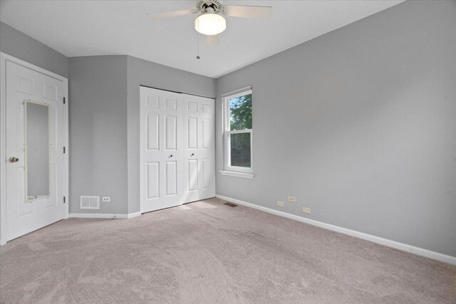 232 Lexington Ct, Grayslake, IL 60030 - unfurnished bedroom featuring carpet flooring, a closet, and ceiling fan