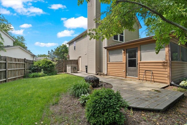 232 Lexington Ct, Grayslake, IL 60030 - back of property featuring an outdoor fire pit, a deck, a chimney, and a sunroom