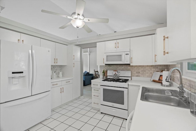 232 Lexington Ct, Grayslake, IL 60030 - kitchen with white appliances, backsplash, white cabinetry, and light countertops