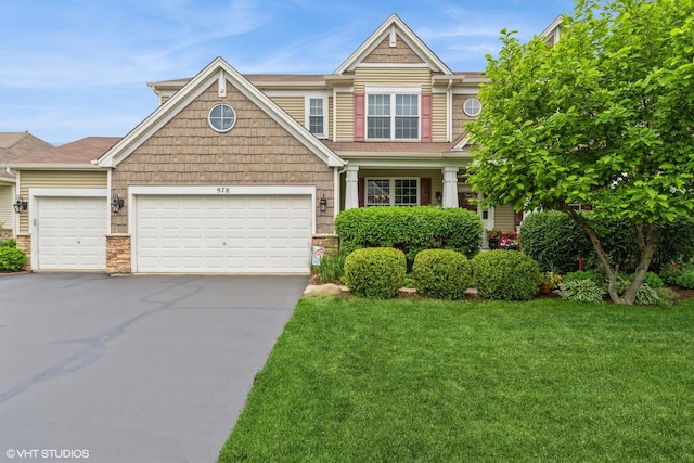 978 Forestview Way, Antioch, IL 60002 - craftsman-style house with a garage, asphalt driveway, a front yard, and stone siding