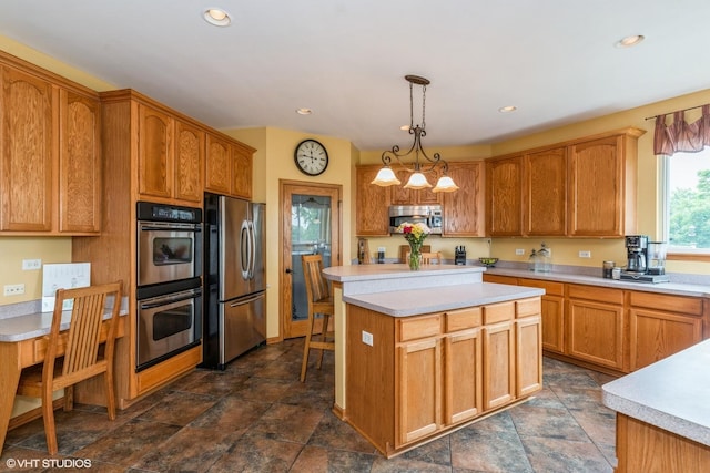 978 Forestview Way, Antioch, IL 60002 - kitchen with appliances with stainless steel finishes, light countertops, a kitchen island, recessed lighting, and pendant lighting