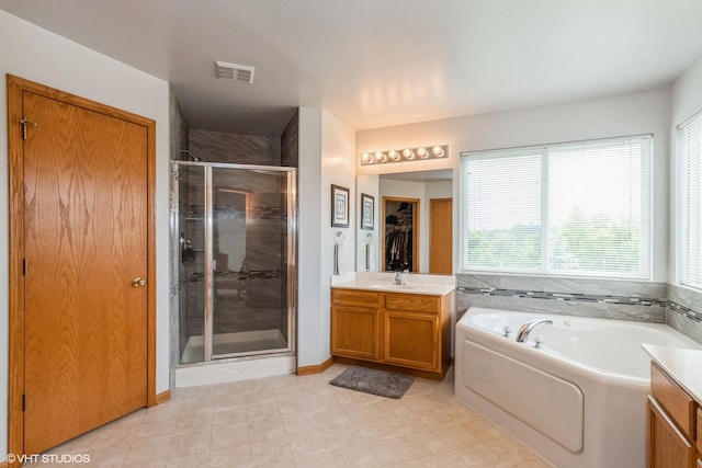 978 Forestview Way, Antioch, IL 60002 - full bath featuring a shower stall, a garden tub, vanity, and tile patterned floors