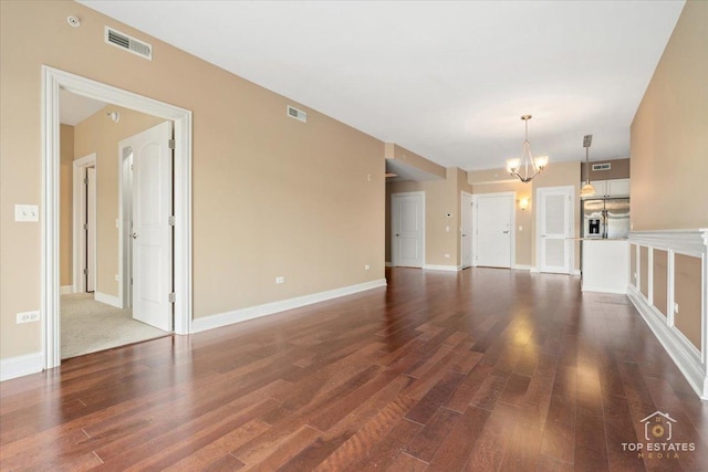 435 W Wood St Unit 410A, Palatine, IL 60067 - unfurnished living room with a chandelier, dark wood finished floors, and baseboards