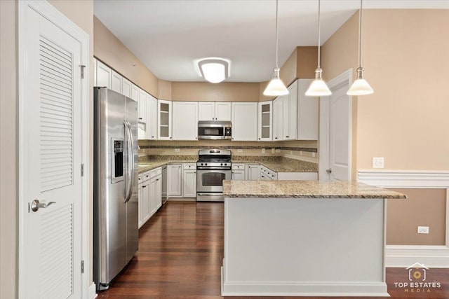 435 W Wood St Unit 410A, Palatine, IL 60067 - kitchen with stainless steel appliances, backsplash, light stone counters, dark wood finished floors, and white cabinetry