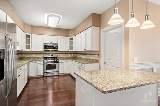 435 W Wood St Unit 410A, Palatine, IL 60067 - kitchen featuring appliances with stainless steel finishes, dark wood-type flooring, white cabinets, and light stone counters