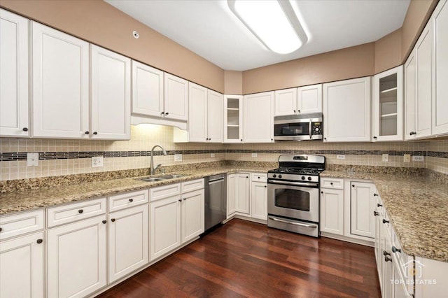435 W Wood St Unit 410A, Palatine, IL 60067 - kitchen featuring stainless steel appliances, a sink, tasteful backsplash, dark wood-style flooring, and white cabinets