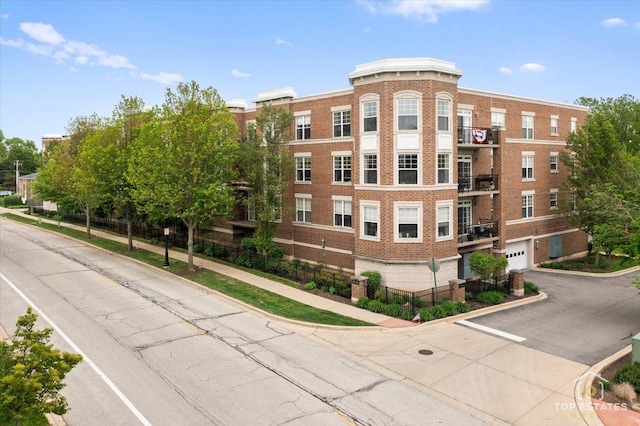435 W Wood St Unit 410A, Palatine, IL 60067 - view of property with asphalt driveway and an attached garage