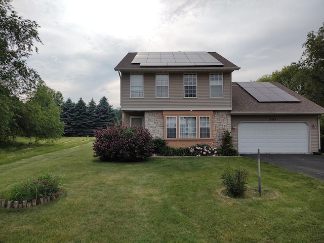 303 Lamplighter Loop, Poplar Grove, IL 61065 - colonial home with solar panels, stone siding, a garage, and a front yard