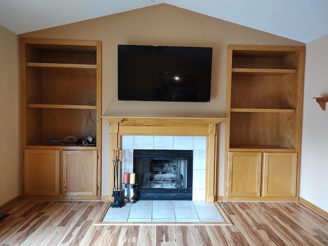 303 Lamplighter Loop, Poplar Grove, IL 61065 - detailed view of wood finished floors, built in shelves, and a tiled fireplace