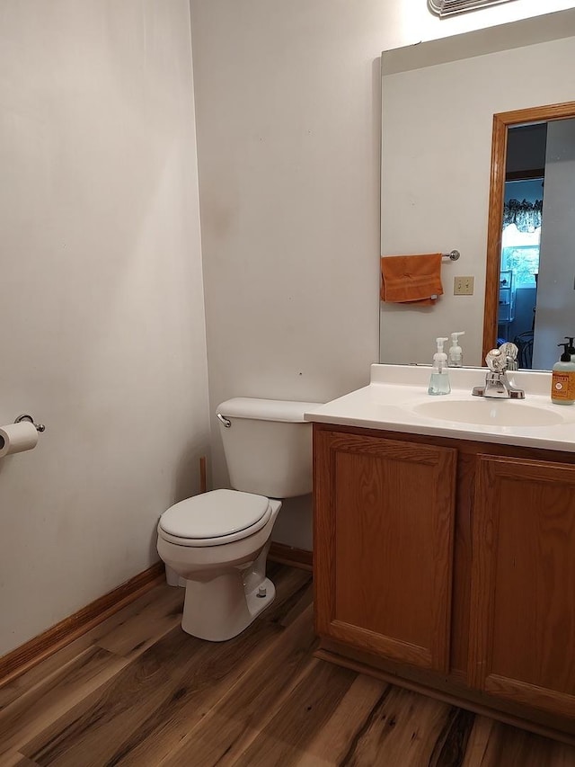 303 Lamplighter Loop, Poplar Grove, IL 61065 - bathroom featuring toilet, vanity, and wood finished floors