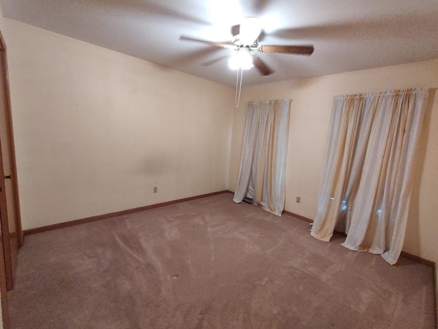 303 Lamplighter Loop, Poplar Grove, IL 61065 - spare room with a ceiling fan, light colored carpet, and baseboards