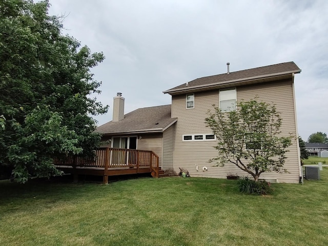 303 Lamplighter Loop, Poplar Grove, IL 61065 - back of house featuring a wooden deck, a chimney, a lawn, and central AC unit