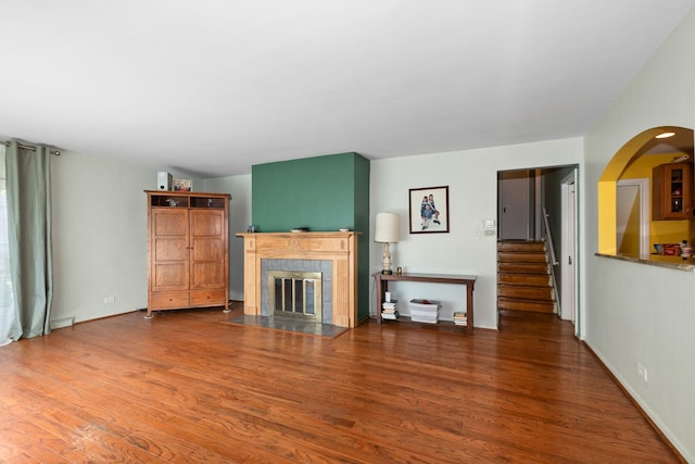 11530 S Campbell Ave, Chicago, IL 60655 - living room featuring wood finished floors, a fireplace, stairway, and arched walkways