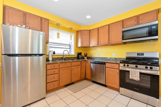 11530 S Campbell Ave, Chicago, IL 60655 - kitchen featuring appliances with stainless steel finishes, brown cabinets, light tile patterned floors, pendant lighting, and recessed lighting