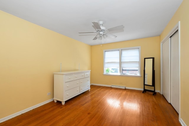 11530 S Campbell Ave, Chicago, IL 60655 - unfurnished bedroom featuring light wood-type flooring, a closet, baseboard heating, and ceiling fan