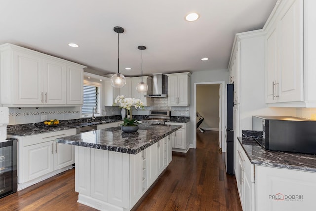 2965 Keystone Rd, Northbrook, IL 60062 - kitchen featuring wall chimney range hood, black microwave, white cabinetry, decorative backsplash, and beverage cooler