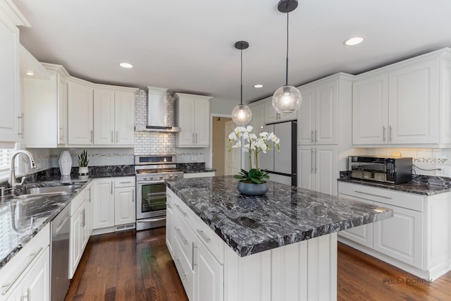 2965 Keystone Rd, Northbrook, IL 60062 - kitchen featuring stainless steel appliances, wall chimney exhaust hood, white cabinets, and recessed lighting