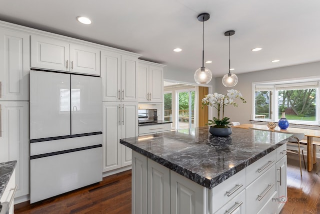 2965 Keystone Rd, Northbrook, IL 60062 - kitchen with freestanding refrigerator, white cabinetry, dark wood-style flooring, decorative light fixtures, and recessed lighting