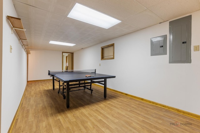 2965 Keystone Rd, Northbrook, IL 60062 - rec room featuring electric panel, light wood finished floors, and a drop ceiling