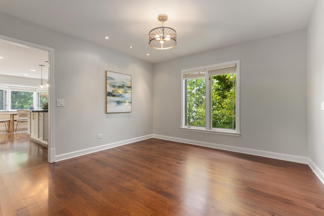 2965 Keystone Rd, Northbrook, IL 60062 - empty room with a chandelier, dark wood-type flooring, and recessed lighting