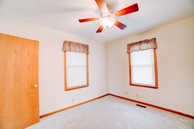 538 E Mulberry St, Watseka, IL 60970 - empty room with healthy amount of natural light, carpet floors, and baseboards