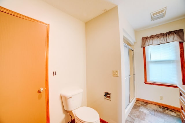 538 E Mulberry St, Watseka, IL 60970 - bathroom with toilet, a shower with door, baseboards, and vanity