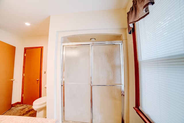 538 E Mulberry St, Watseka, IL 60970 - full bathroom featuring toilet, a stall shower, wood finished floors, and recessed lighting