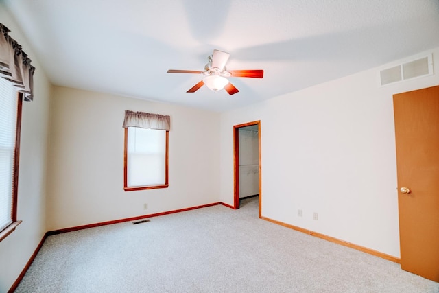 538 E Mulberry St, Watseka, IL 60970 - unfurnished room with healthy amount of natural light, carpet flooring, a ceiling fan, and baseboards