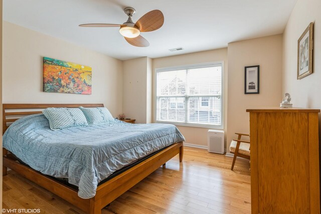 6812 Meadow Ln, Morton Grove, IL 60053 - bedroom featuring light wood-style flooring and a ceiling fan