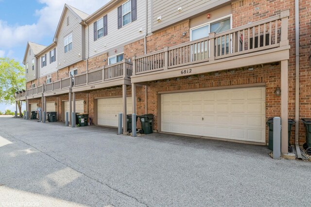 6812 Meadow Ln, Morton Grove, IL 60053 - rear view of property with brick siding and a garage