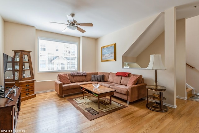 6812 Meadow Ln, Morton Grove, IL 60053 - living area with light wood-style flooring, a ceiling fan, and stairs
