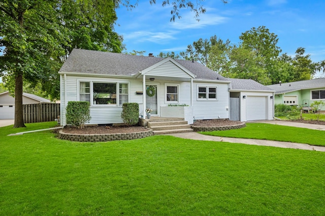1005 N Walnut St, Normal, IL 61761 - view of front facade featuring an attached garage, driveway, and a shingled roof