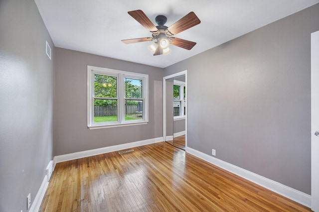 1005 N Walnut St, Normal, IL 61761 - empty room featuring hardwood / wood-style floors and a ceiling fan