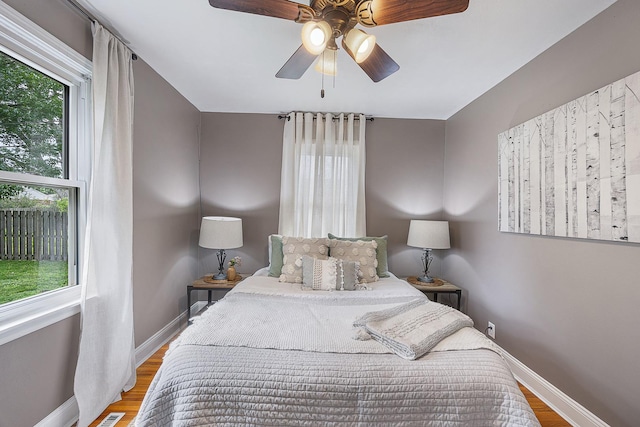1005 N Walnut St, Normal, IL 61761 - bedroom with wood finished floors and a ceiling fan