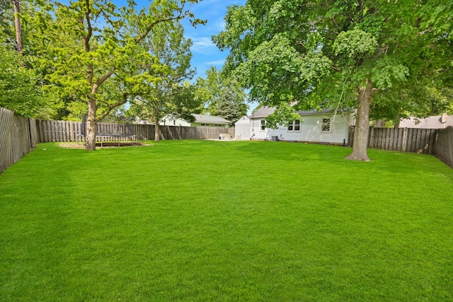 1005 N Walnut St, Normal, IL 61761 - fenced backyard featuring a trampoline