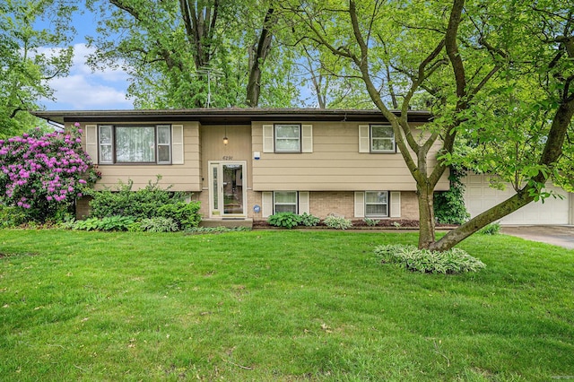 6291 Fallen Timbers Ave, Portage, IN 46368 - split foyer home featuring a front yard, concrete driveway, and brick siding